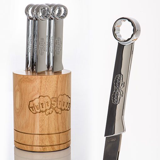 Wrench handle steak knives in piston-inspired wooden storage block